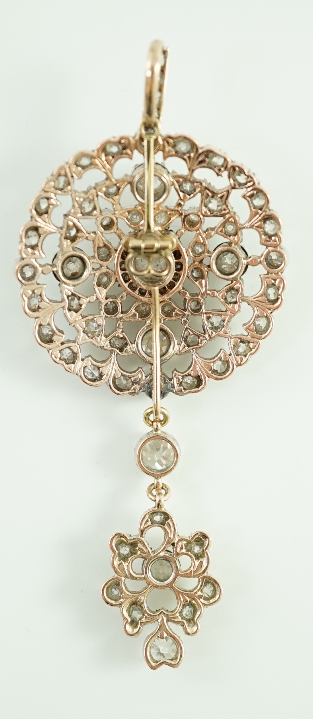 A Victorian gold, silver and graduated diamond cluster set target drop pendant brooch, retailed by Carlo & Arthur Giuliano